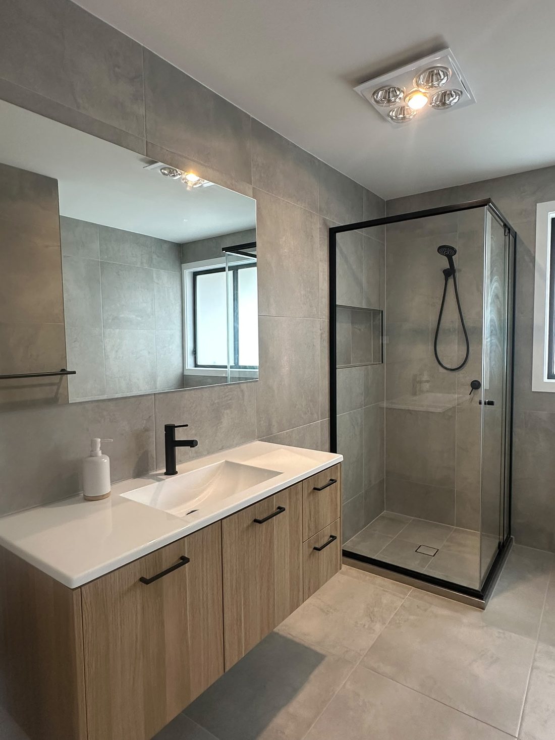 Peakhurst bathroom with a frameless glass shower, timber vanity and large mirror